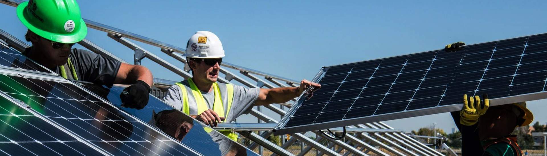 Men working solar panels